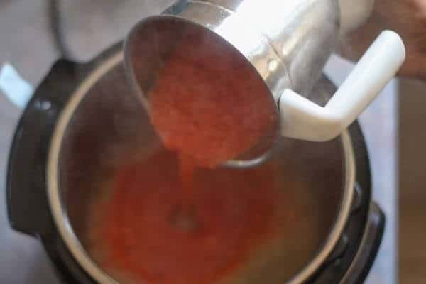 Add tomato puree to thicken the base