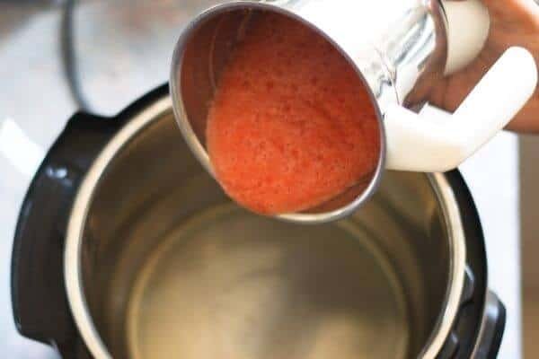 Adding blended paste to cook